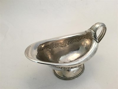 Lot 1249 - A Pair of George V Silver Sauceboats, by Omar Ramsden, London, 1922, each oval and on spreading...