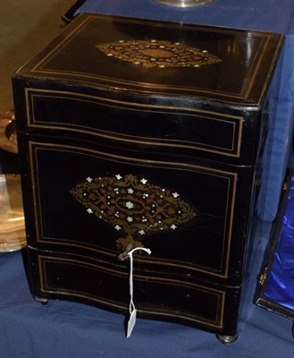 Lot 251 - A late Victorian ebonised cased Tantalus, the outer panels with boulle work decoration and keys