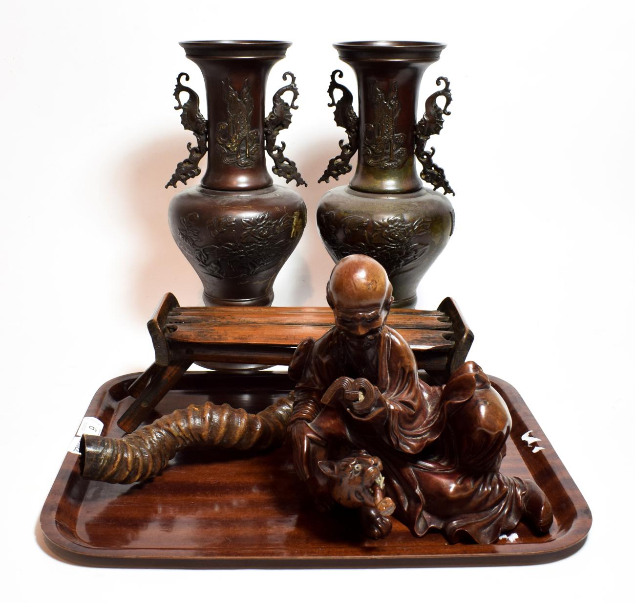 Lot 6 - Japanese items including a pair of bronze vases; a headrest; a rootwood figure; and a horn (5)