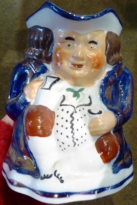 Lot 27 - A German porcelain figure of a drunken soldier together with three Toby jugs and other ceramics...