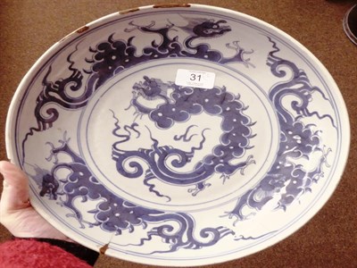 Lot 31 - An 18th century Chinese dish, blue and white dragon & flaming pearl design, 29.5cm diameter, (a.f.)