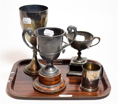 Lot 36 - Two silver twin handled trophy cups, a small silver tankard, a silver plated goblet, (4)