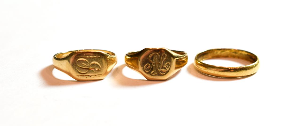 Lot 44 - Two 9 carat gold signet rings, finger sizes J and K; and an 18 carat gold band ring, finger size L