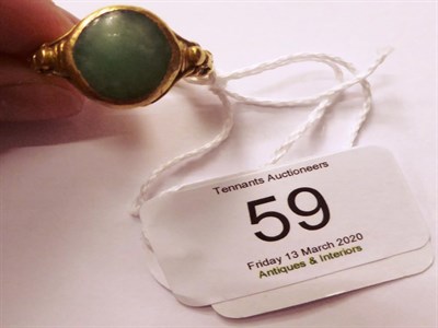 Lot 59 - A jade type ring, finger size T