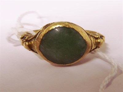 Lot 59 - A jade type ring, finger size T