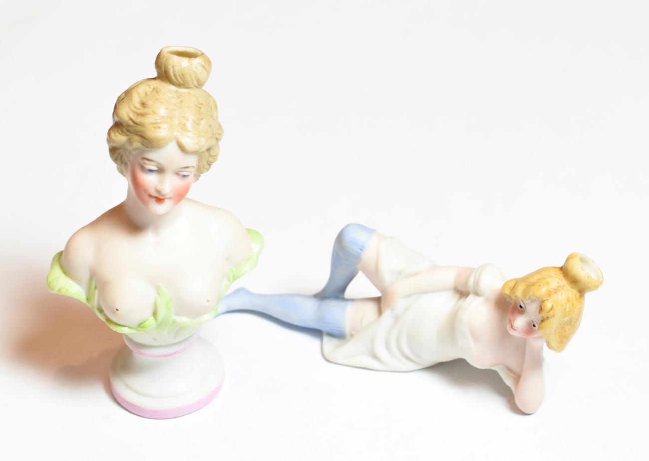 Lot 85 - An early 20th century German bisque 'squirter', unmarked, modelled as a reclining woman with raised
