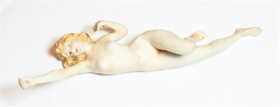 Lot 87 - An early 20th Century German bisque figure of a nude young woman, unmarked, modelled stretching...