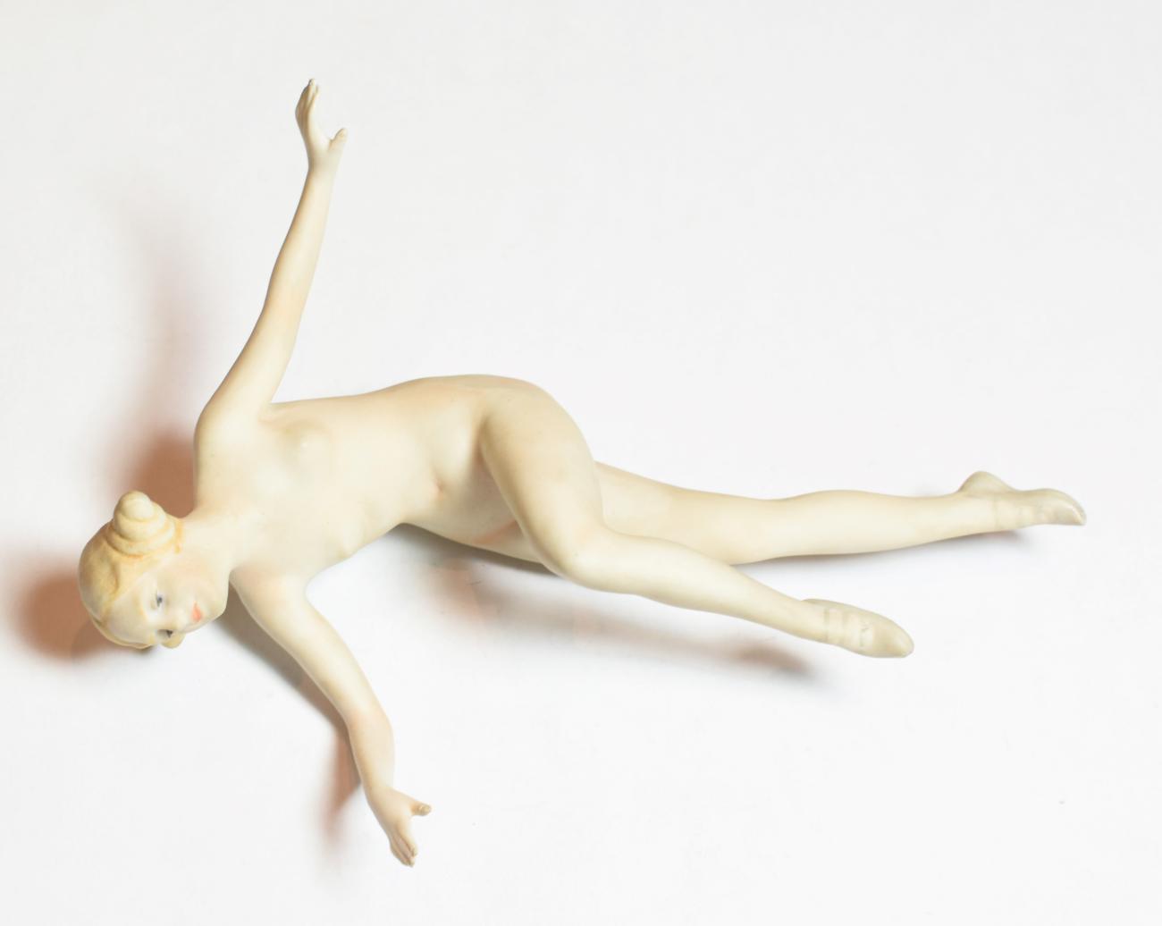 Lot 90 - An early 20th century German bisque figure of a nude young dancer, unmarked, modelled in action...