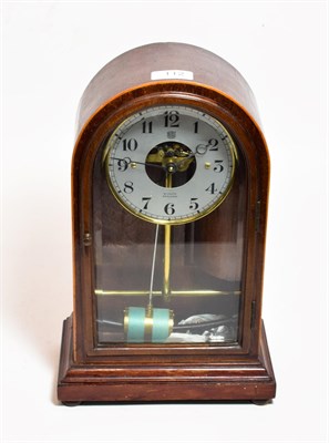 Lot 112 - A mahogany cased electric mantel timepiece, the dial signed W Louth, Spalding, bulle patent