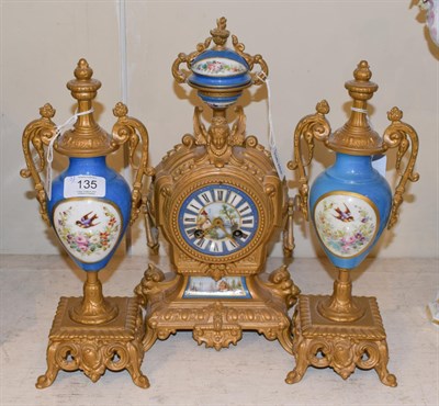 Lot 135 - A gilt metal and porcelain mounted striking mantel clock garniture circa, 1870