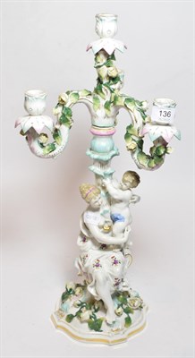 Lot 136 - A German porcelain floral encrusted four light candelabra
