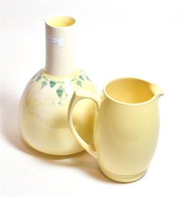 Lot 171 - A Wedgwood jug, designed by Keith Murray and a Ruskin pottery vase, dated 1919 (2)