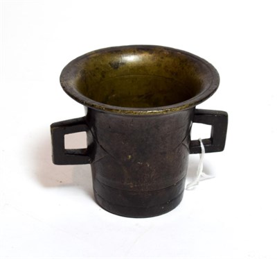 Lot 194 - A bronze mortar, possibly German, 16th/17th century, of flared cylindrical form with angular...