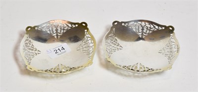 Lot 214 - A pair of pierced silver pedestal dishes, S J Levi & Co, Birmingham 1933, 14cm diameter