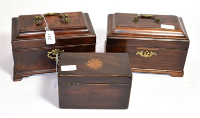 Lot 241 - A George III mahogany and crossbanded tea caddy and key; together with two further examples (3)