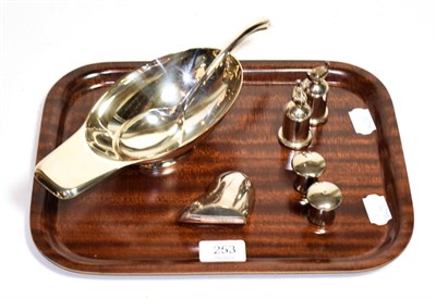 Lot 253 - A salt and pepperette, by Christofle; together with a paperweight and a sauce boat & ladle, and...