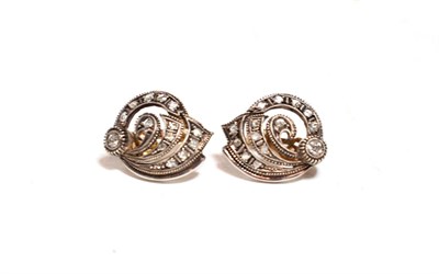 Lot 277 - A pair of diamond cluster earrings, the scroll motif set throughout with rose cut and old cut...