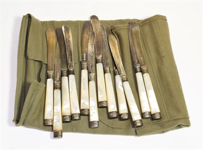 Lot 280 - A set of twelve silver and mother of pearl butter knives, Hutton & Sons, Sheffield, 1911,...