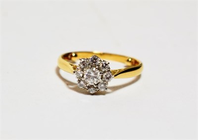 Lot 297 - A diamond cluster ring, finger size J1/2 approximately (sizing beads to inner shank)