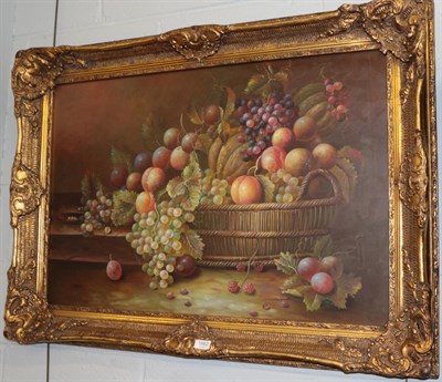 Lot 1062 - British School, 20th Century, still life of fruits and vine leaves in a basket on a stone...