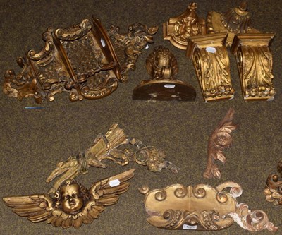 Lot 1091 - A quantity of gilt wood wall brackets and furniture elements, together with two gilt framed...