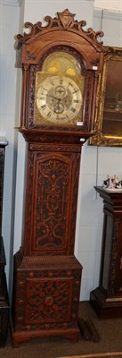 Lot 1170 - A Victorian carved oak 8 day long case clock, with silvered dial F.K Perkins and Sons, Wakefield