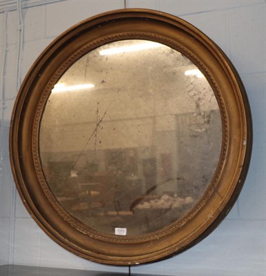Lot 1172 - A Regency circular gilt wood mirror, 82cm diameter