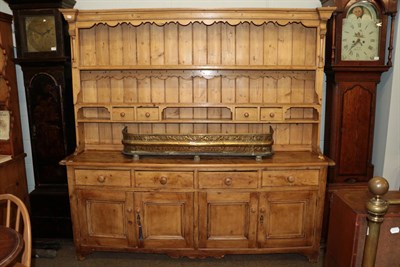 Lot 1179 - A pine dresser with associated plate rack, 208cm wide