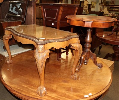 Lot 1186 - Four pieces of reproduction furniture compromising: A walnut coffee table, an inlaid tripod...