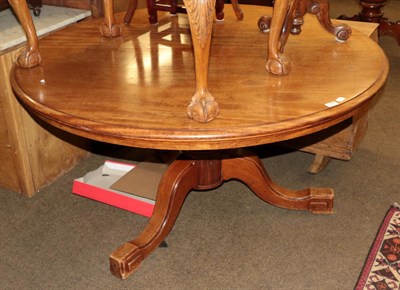 Lot 1187 - A Victorian mahogany circular pedestal table with paper label, Howard and Sons upholsterers...