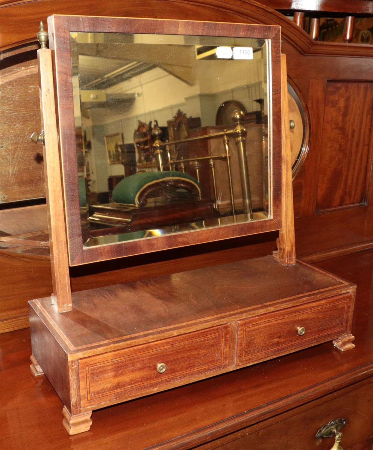 Lot 1196 - A Victorian pine cradle; and a Victorian mahogany toilet mirror with two drawers (2)