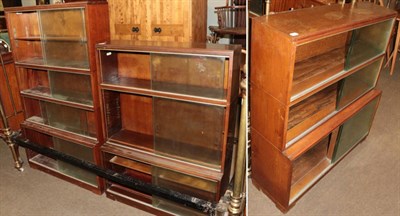 Lot 1202 - A mahogany glazed bookcase, smaller example and a further oak smaller example (3)