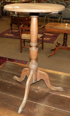 Lot 1207 - A George III oak tripod table
