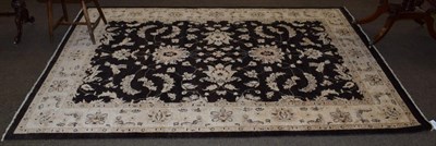 Lot 1219 - Afghan ''Ziegler'' carpet, the deep walnut brown field of scrolling vines enclosed by ivory...