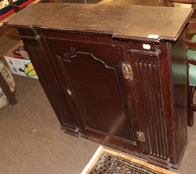 Lot 1220 - An 18th Century oak inverted breakfront cupboard stamped 'Johnstone and Jeanes', 97cm wide