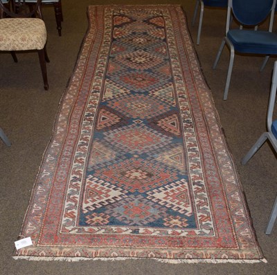 Lot 1222 - North West Persian runner, the field of hooked güls enclosed by triple narrow borders, 281cm...
