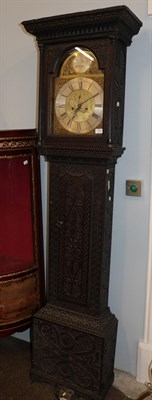 Lot 1254 - ~ A carved oak eight day longcase clock, arch brass dial signed Peter Hogg, Felton, 18th...