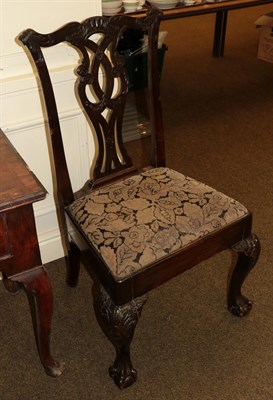 Lot 1282 - An 18th century carved mahogany dining chair with drop in seat, raised on carved fore legs