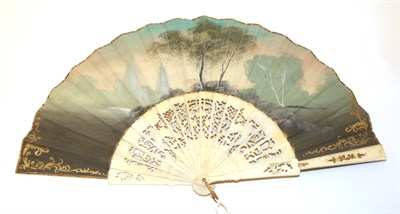Lot 4026 - An Interesting 20th Century Bone Fan, the monture carved and pierced , the double fabric leaf...