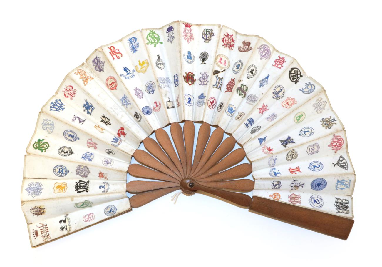 Lot 4033 - A Telescopic Wood Fan, the monture mid brown and unadorned, the double paper leaf decorated...