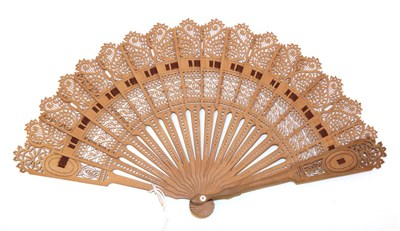 Lot 4034 - A Mid-19th Century Carved and Pierced Wood Brisé Fan, European, shaped to emulate a folding...