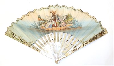 Lot 4055 - An Early 20th Century Mother-of-Pearl Fan, the pearl white, and gilded with flowers. The cream silk