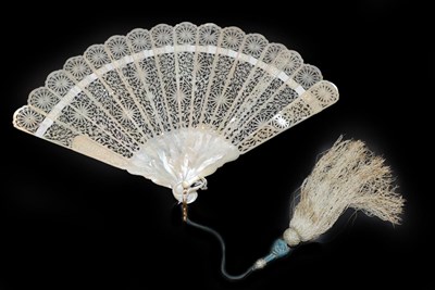 Lot 4077 - A Scarce Carved and Pierced Cream Mother-of-Pearl Fan, with iridescent shading when held to the...