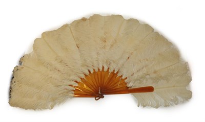 Lot 4082 - A Cream Ostrich Feather Fan, circa 1900, medium to large size, the feathers mounted on resin...