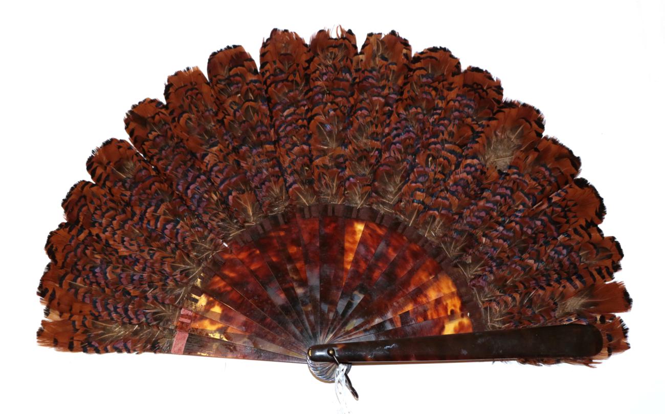 Lot 4084 - A Good Pheasant Feather Fan, circa 1880's, the monture a large brisé fan in tortoiseshell,...