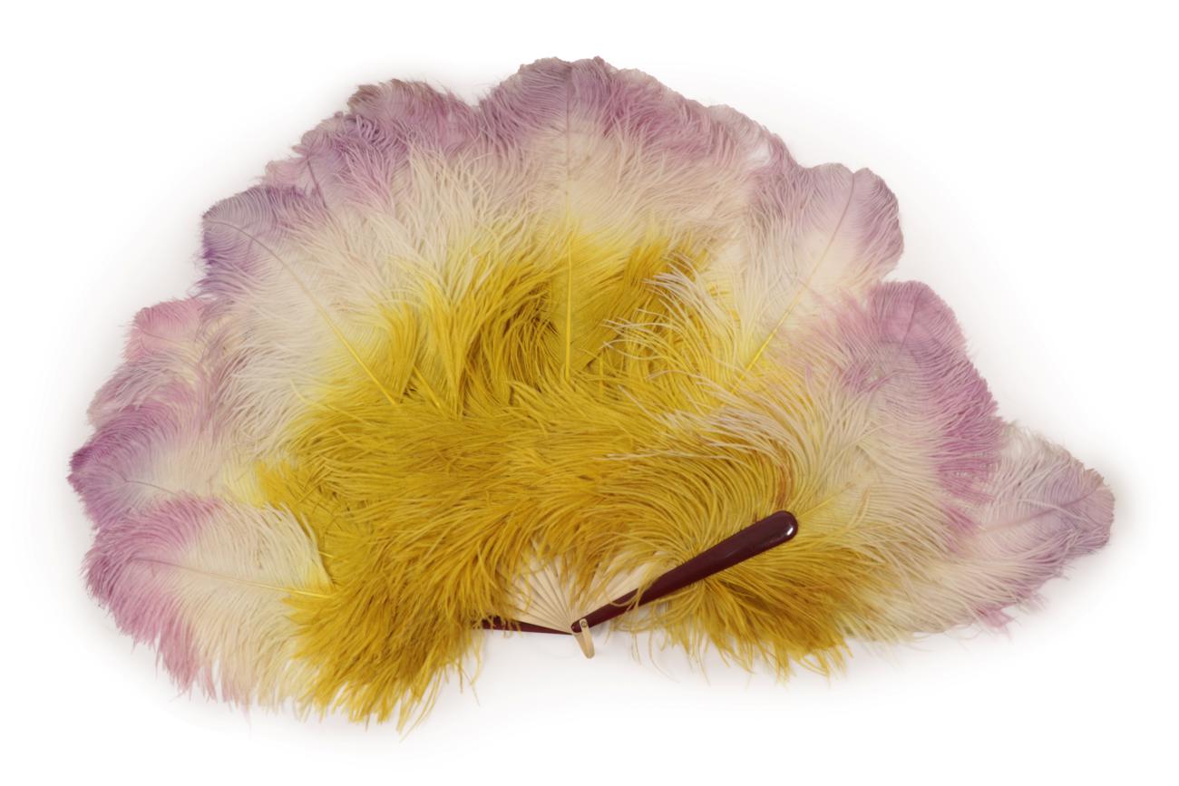 Lot 4088 - An Extravagant Large Ostrich Feather Fan, circa 1900, the monture unusually a mix of dark brown...