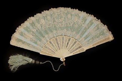 Lot 4097 - A Third Quarter 19th Century Lace Fan, the monture of bone, carved, and pierced, fitted from behind