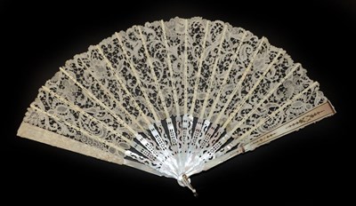 Lot 4105 - A White Mother-of-Pearl Fan, circa 1900, the monture carved and pierced, silvered and gilded in...