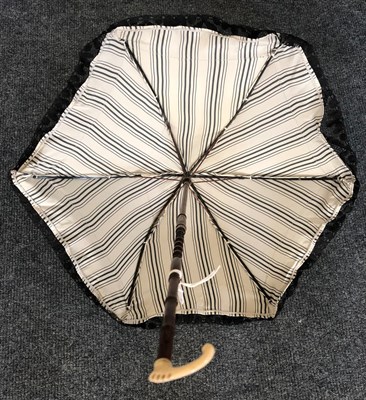 Lot 4114 - A Mid-19th Century Folding Parasol, the ivory shaft elegantly shaped and ending in something...