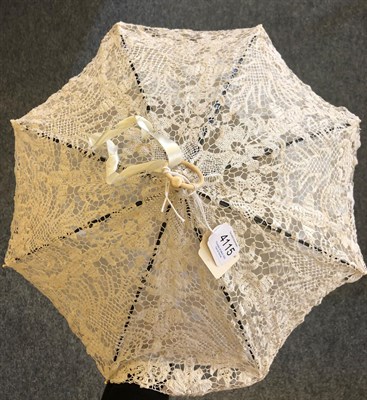 Lot 4115 - A 19th Century Folding Parasol, the cover of light cream tapelace, perhaps Milanese, the lining...